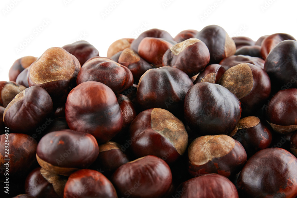 Many peeled chestnuts lie on white background. Isolated Many peeled chestnuts lie on white background. Isolated