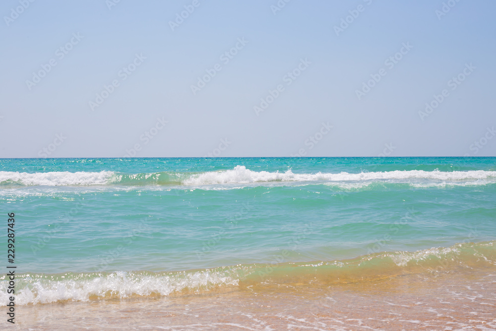 azure seashore with waves