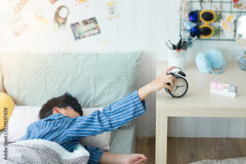 Photography A kids waking up to an alarm clock in the bedroom