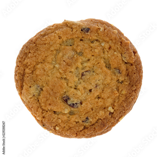 Top view of a single cranberry and oat cookie isolated on a white background.