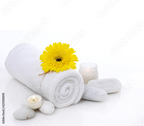 Spa setting on mat with many salt,pink orchid on towel,candle