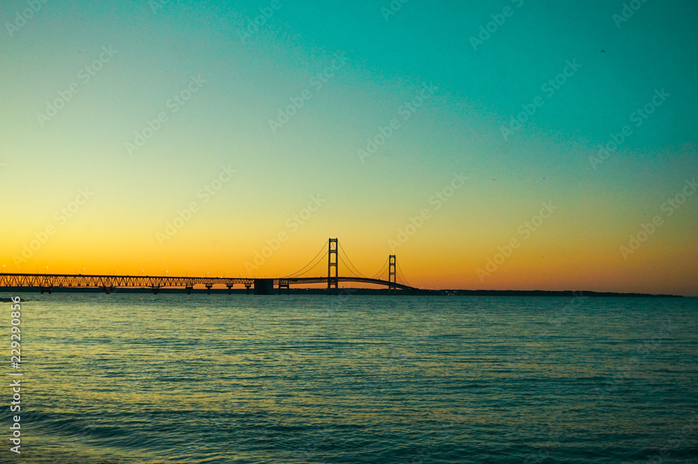 Bridge, Beach and Water At Sunset