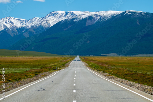 Asphalt road and mountains. Altai Republic, Russia