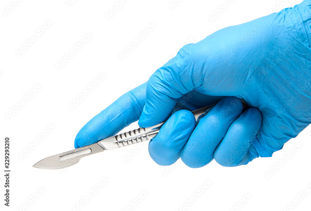 Φωτογραφία Scalpel in the hands of doctor in gloves isolated on white background