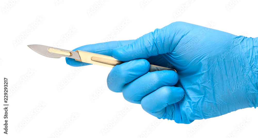 Scalpel in the hands of doctor in gloves isolated on white background. Surgeon with knife before surgery Scalpel in the hands of doctor in gloves isolated on white background. Surgeon with knife before surgery