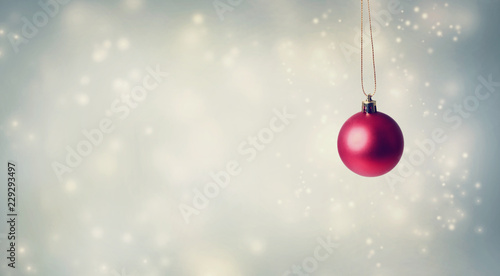 Christmas bauble on a shiny light background