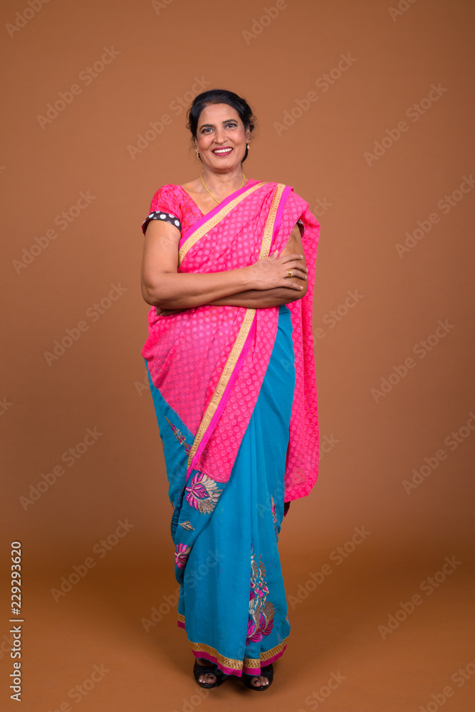 Φωτογραφία Full length shot of happy Indian woman wearing traditional clothes