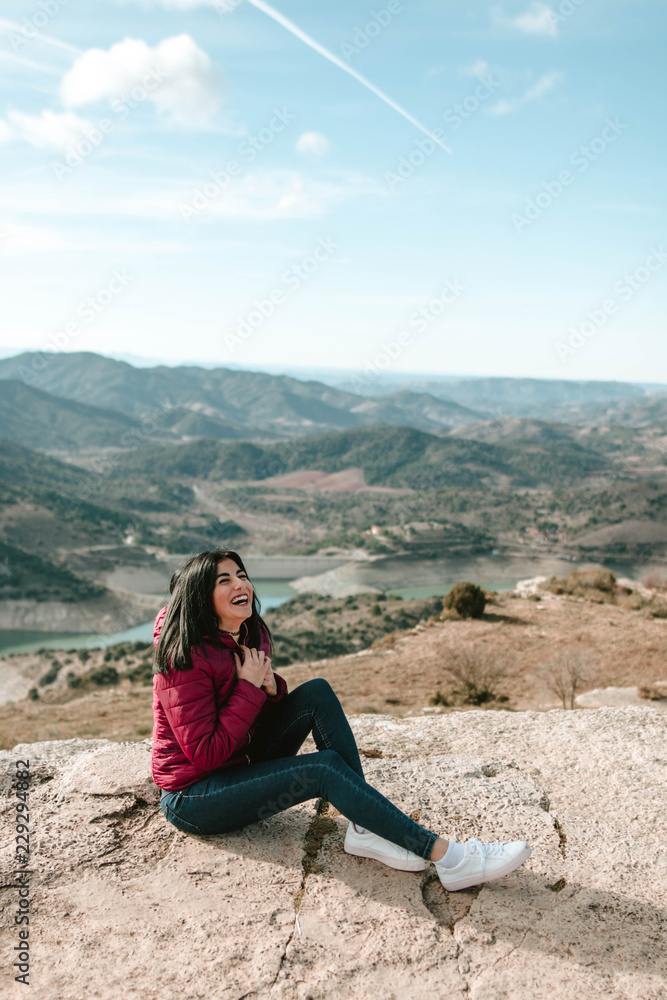Portrait of woman sitting on the mountain Portrait of woman sitting on the mountain