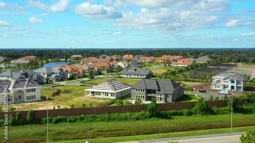 Aerial flyover neighborhood luxury homes under construction photo