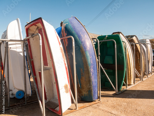 row boats parked arranged in marina charmouth dorset summer day holiday photo