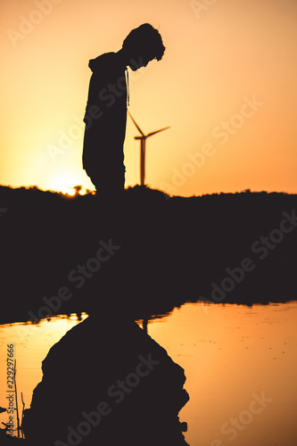 Silhouette of boy during the sunset