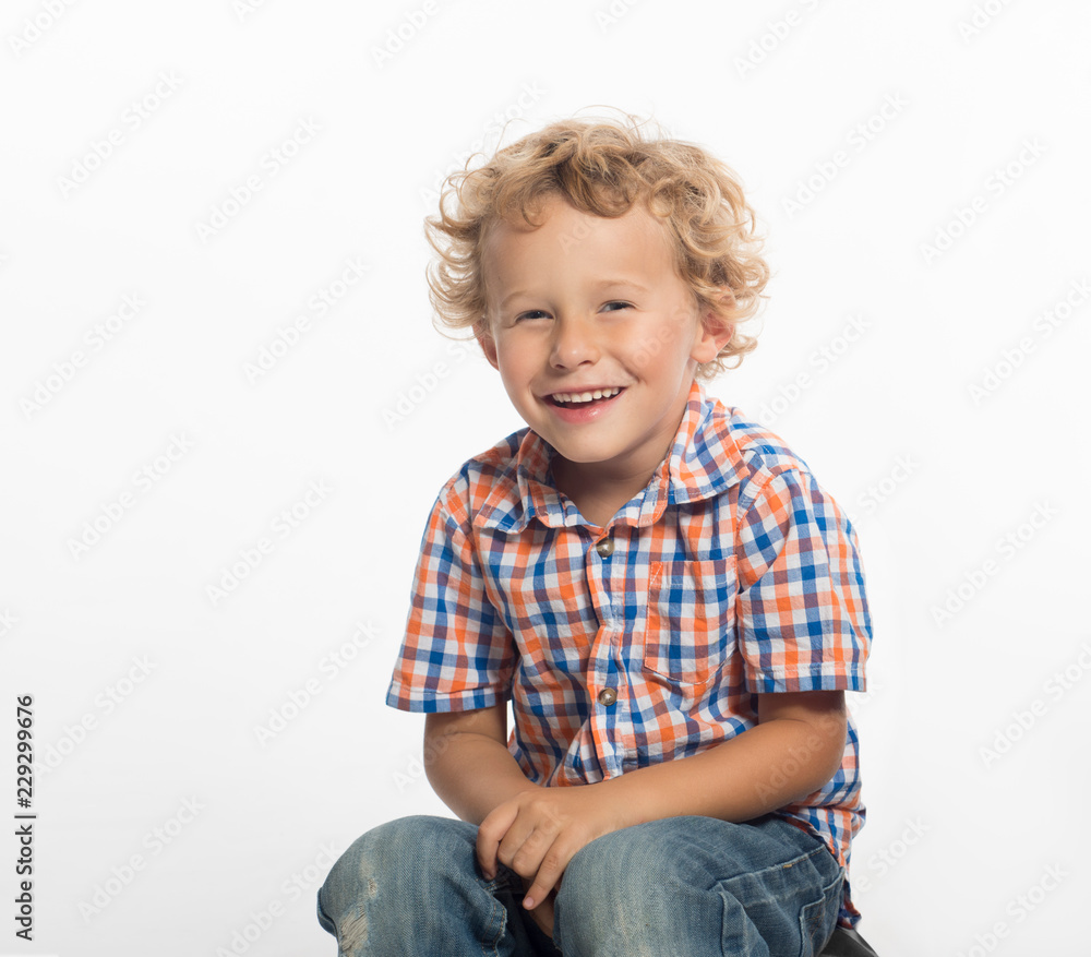 Laughing, little boy with curly blonde hair, isolated on white background Laughing, little boy with curly blonde hair, isolated on white background
