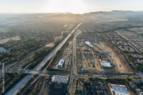 Aerial sunset view of shopping center construction  Rinaldi Street and the 118 freeway in the Porter Ranch community of Los Angeles  California.  