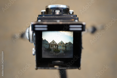 Row of San Francisco homes seen through the viewfinder of a twin photo