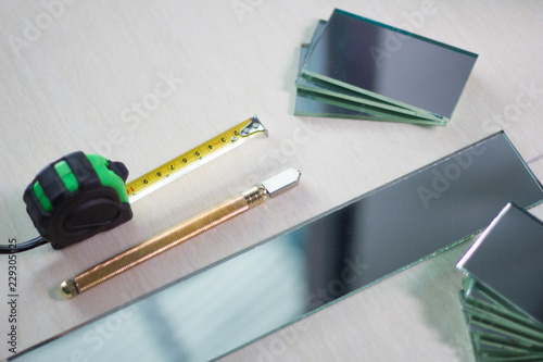 Technicians are using cutting tools, cut glass according to customer size