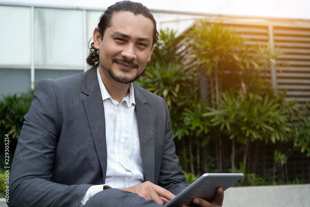 middle eastern business man using tablet outdoor middle eastern business man using tablet outdoor