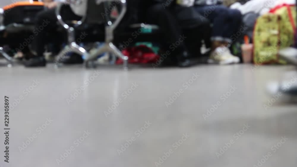 Blurred image of people and passengers walking in terminal hall. Concept of travelling or business. Blurred image of people and passengers walking in terminal hall. Concept of travelling or business.