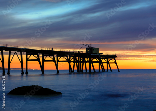 old wooden pier at sunset © Kris