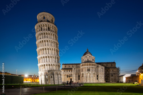 Night view of Pisa Cathedral (Duomo di Pisa) with Leaning Tower of Pisa (Torre di Pisa) on Piazza dei Miracoli in Pisa, Tuscany, Italy. The Leaning Tower of Pisa is one of the main landmark of Italy