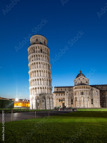 Night view of Pisa Cathedral (Duomo di Pisa) with Leaning Tower of Pisa (Torre di Pisa) on Piazza dei Miracoli in Pisa, Tuscany, Italy. The Leaning Tower of Pisa is one of the main landmark of Italy