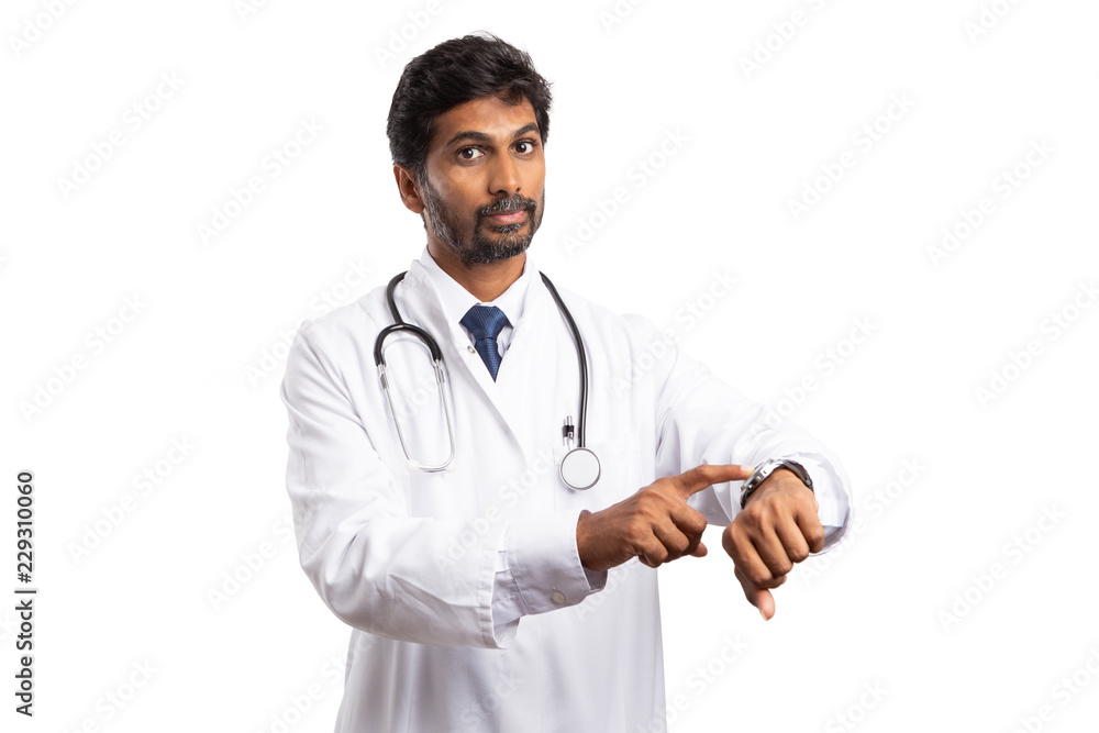Doctor pointing at watch with serious expression. Doctor pointing at watch with serious expression.
