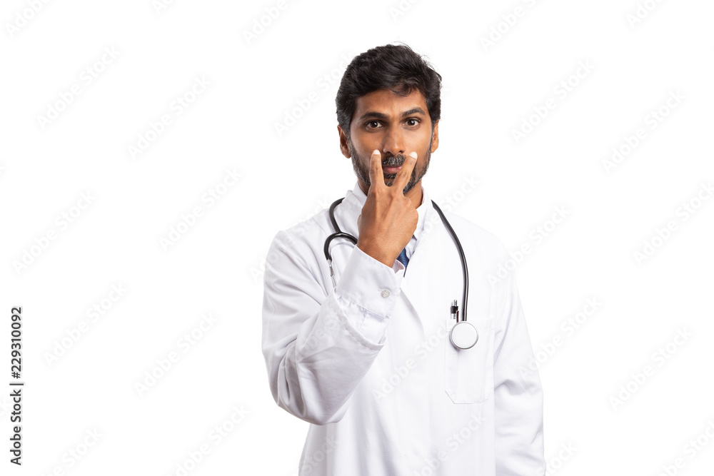 Doctor pointing at himself as look into my eyes gesture. Doctor pointing at himself as look into my eyes gesture.