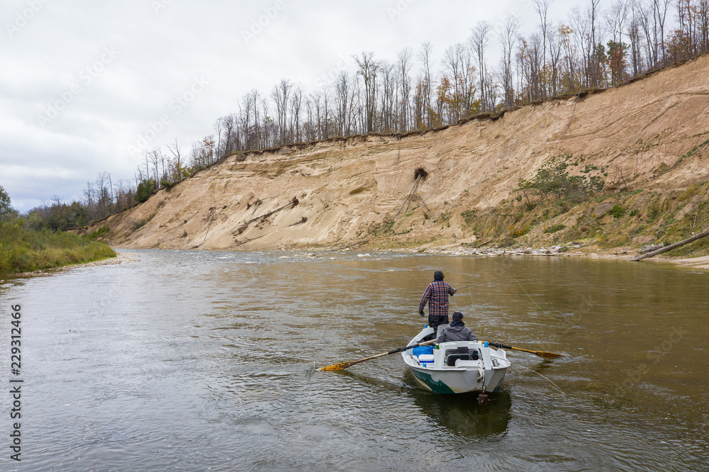 Aerial drone shot of drift boat fly fishing in Ontario, Canada