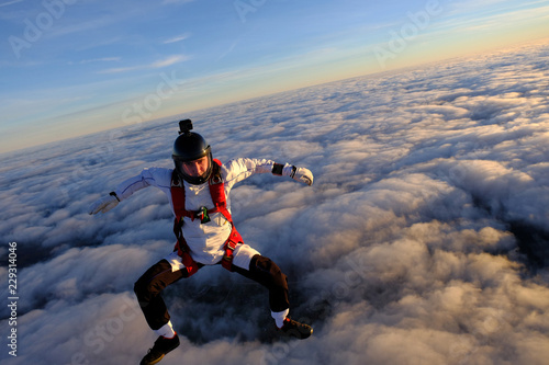 Skydiver is in the sky above clouds. © Sky Antonio