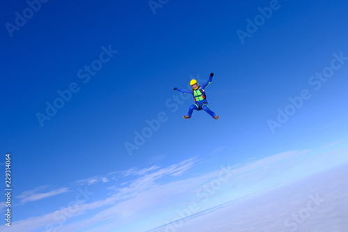 Sport girl is flying in the sky.
