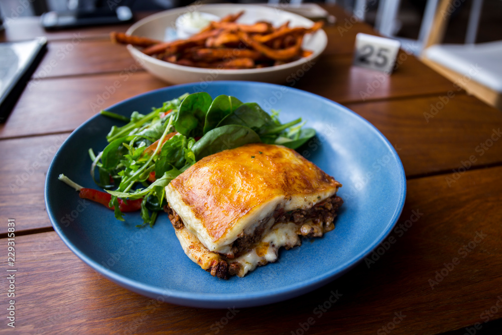 Meat Lasagna with fresh salad, sweet potato chips Meat Lasagna with fresh salad, sweet potato chips