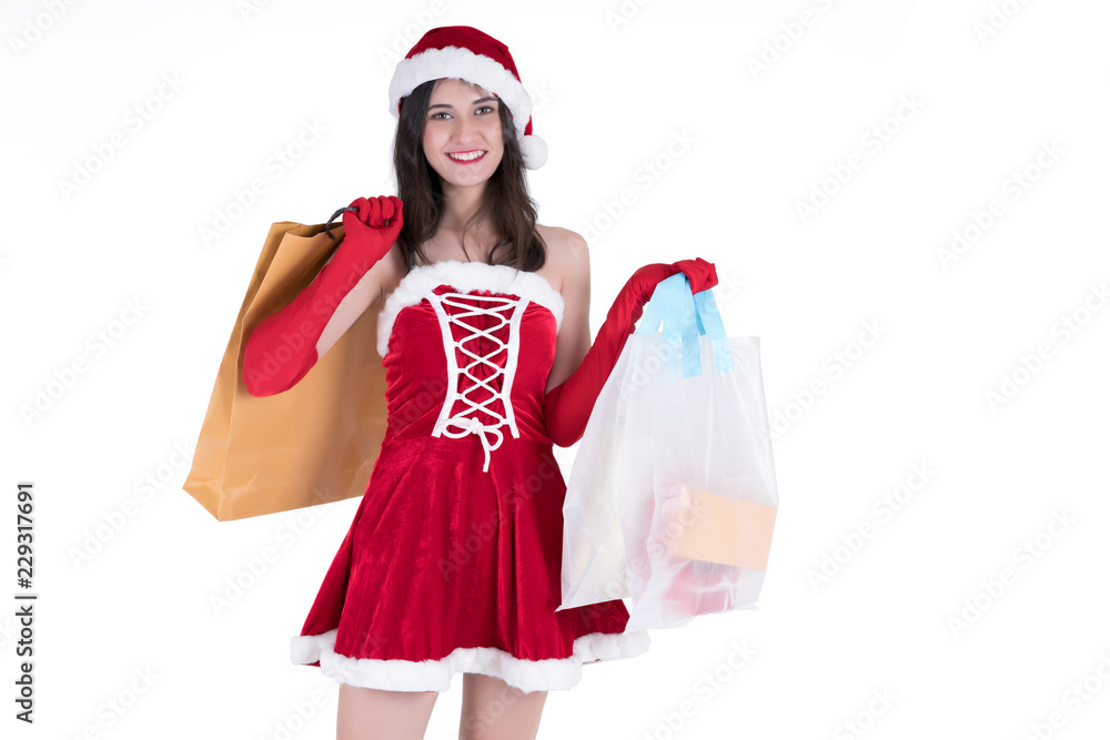 Christmas concept : Beautiful smiling young Asian woman in Santa Claus costume holding shopping bags isolated on white background Christmas concept : Beautiful smiling young Asian woman in Santa Claus costume holding shopping bags isolated on white background