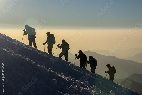 Group of people climbs the mountain Elbrus