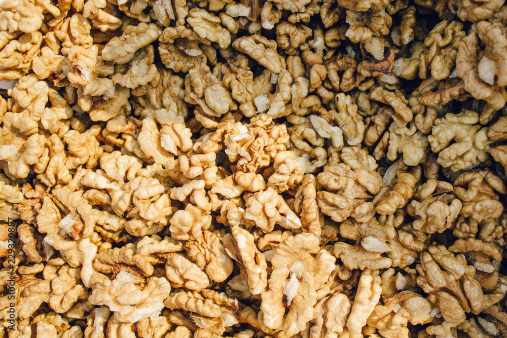 Top view of big shelled walnuts pile in farm market Top view of big shelled walnuts pile in farm market