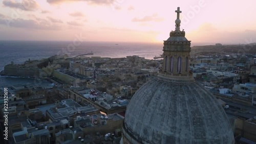 4k drone - Basilica Of Our Lady Mount Carmel at sunrise.  Valletta, Malta. photo