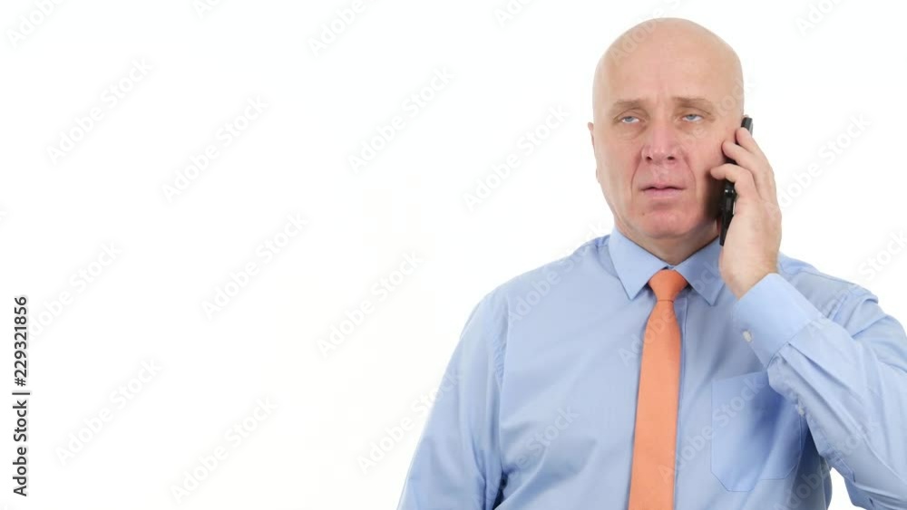 Businessman Talking Cellphone Hear Bad Financials News and Gesticulate Nervous Businessman Talking Cellphone Hear Bad Financials News and Gesticulate Nervous