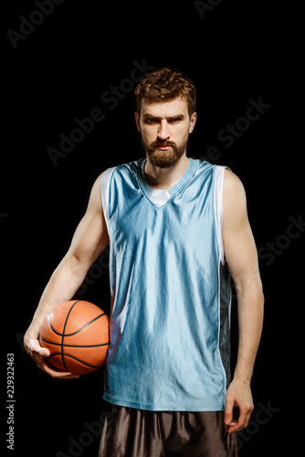 Basketball player isolated on black