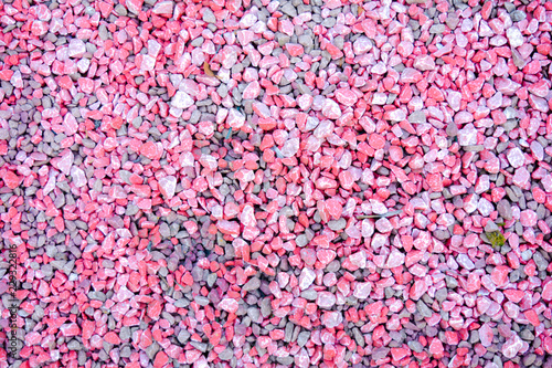 Small pink and grey pebble background. Top view texture © Koxae