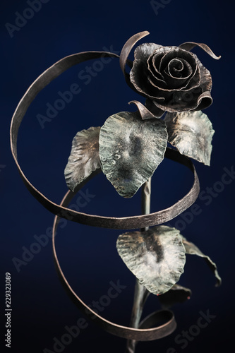 The broze rose with a tape made of metal photo