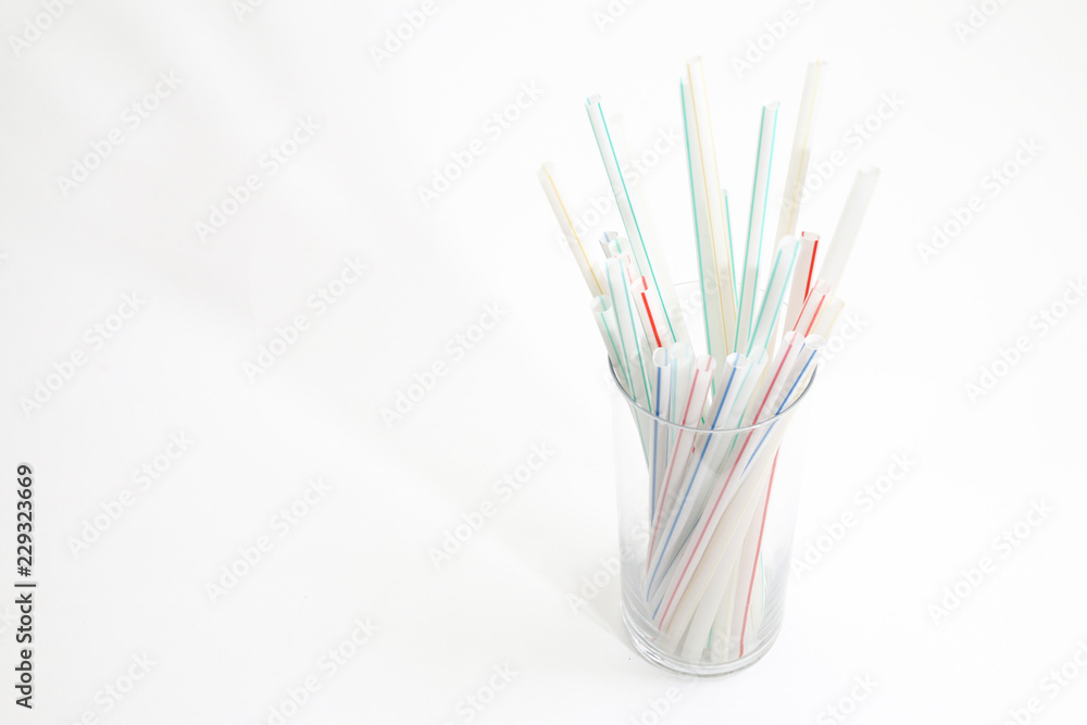 Plastic straws in glass holder