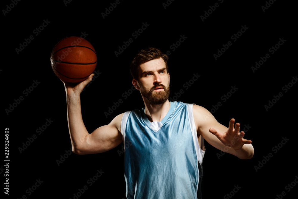 Handsome basketball player shooting ball