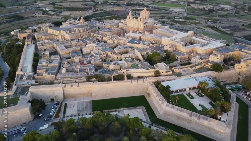 4k sunset drone footage - Ancient medieval fortress city of Mdina ...