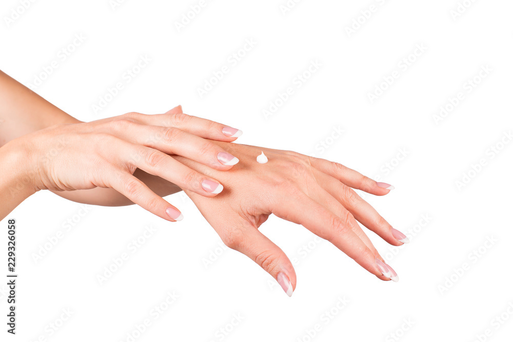 Woman applying cream, female hands, white background, closeup