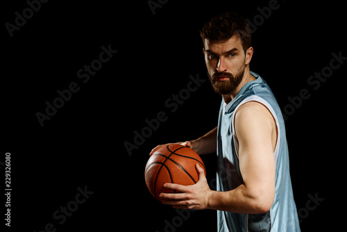 Basketball player holding a ball © yuriygolub