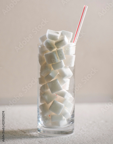 Принти на полотні conceptual macro still life image of refreshment glass full of sugar cubes and s