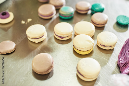 macaroons shells in a tray. Process of making macaron, french dessert,