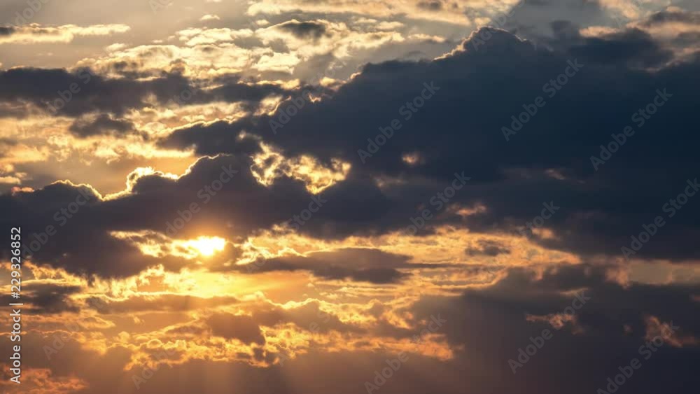 Beautiful yellow cloudscape with large sun. 4K timelapse. Beautiful yellow cloudscape with large sun. 4K timelapse.