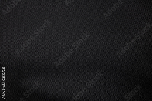 Detail of black textile texture background. Closeup fabric pattern material.