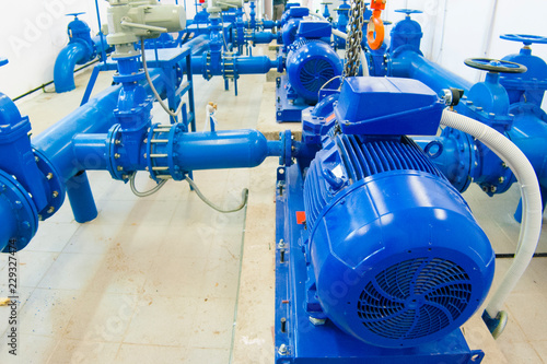 blue pumps in the room for industrial water pumping