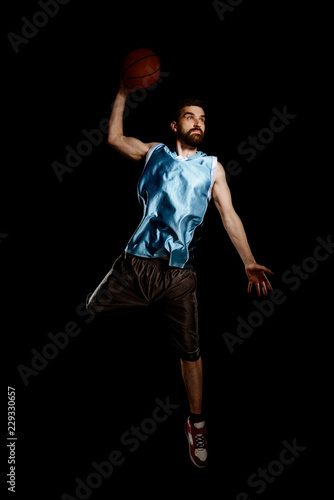 Basketball player jumping to throw © yuriygolub