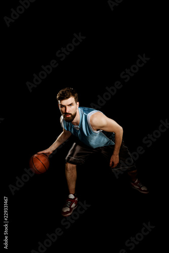 Skilled sportsman dribbling a ball